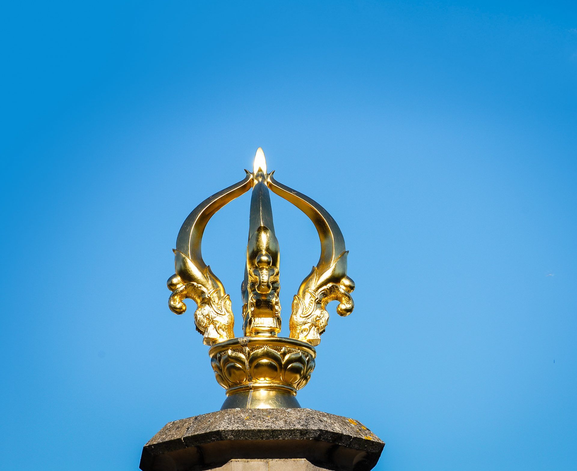 The five-pronged vajra on top of the temple.