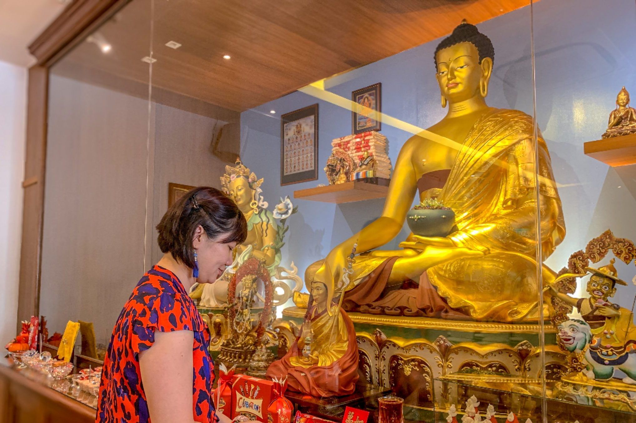 Buddha statue and woman Singapore