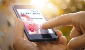 How to Transform Your Life being read on a mobiles phone